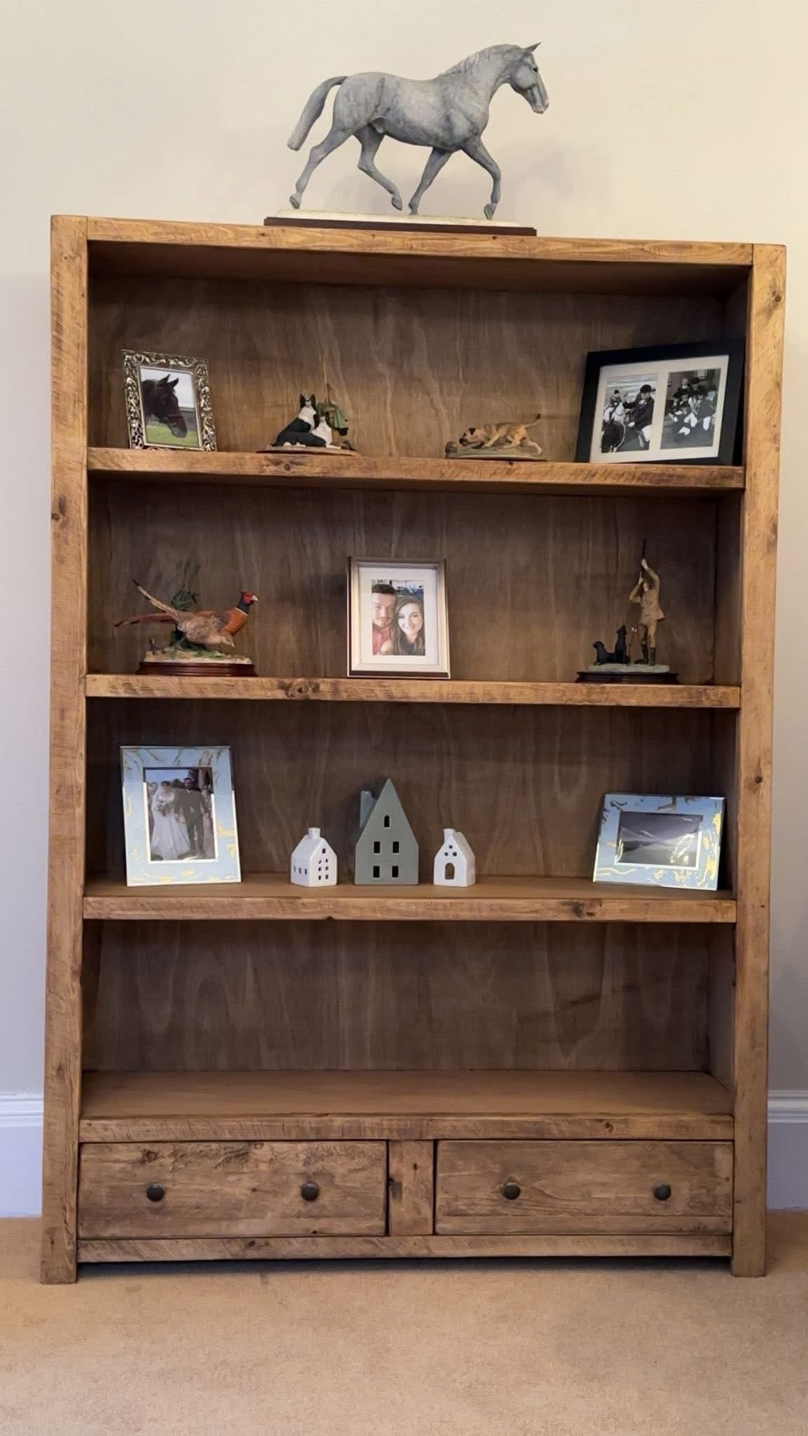 Large rustic wooden bookcase with shelves and two storage drawers