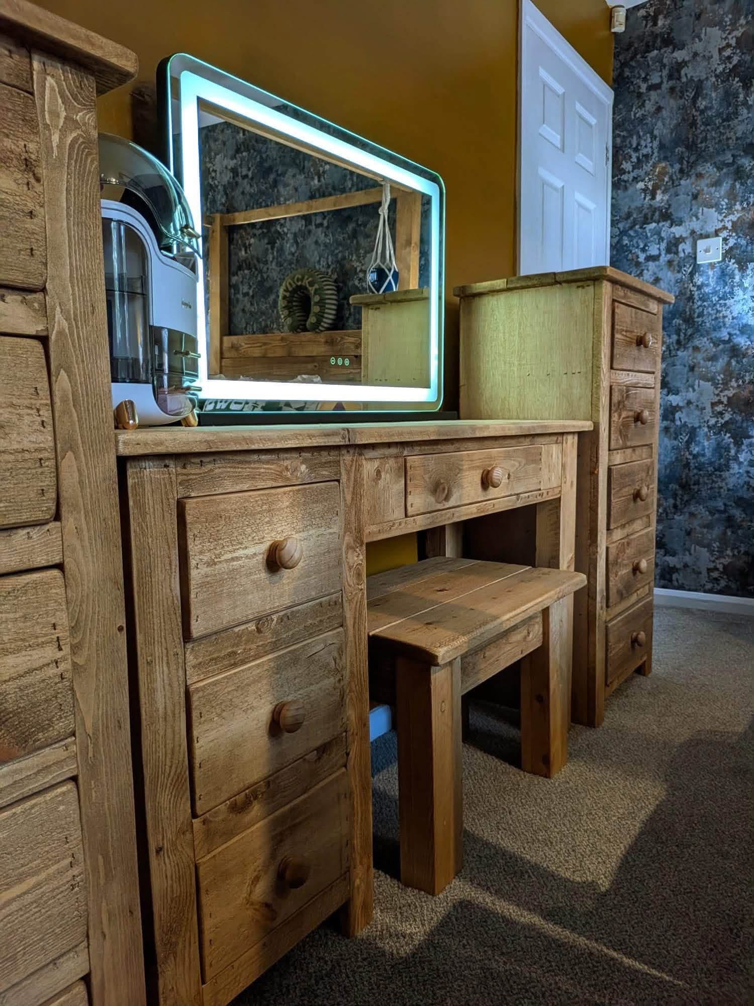Handmade chunky rustic wooden desk and matching stool in a bedroom