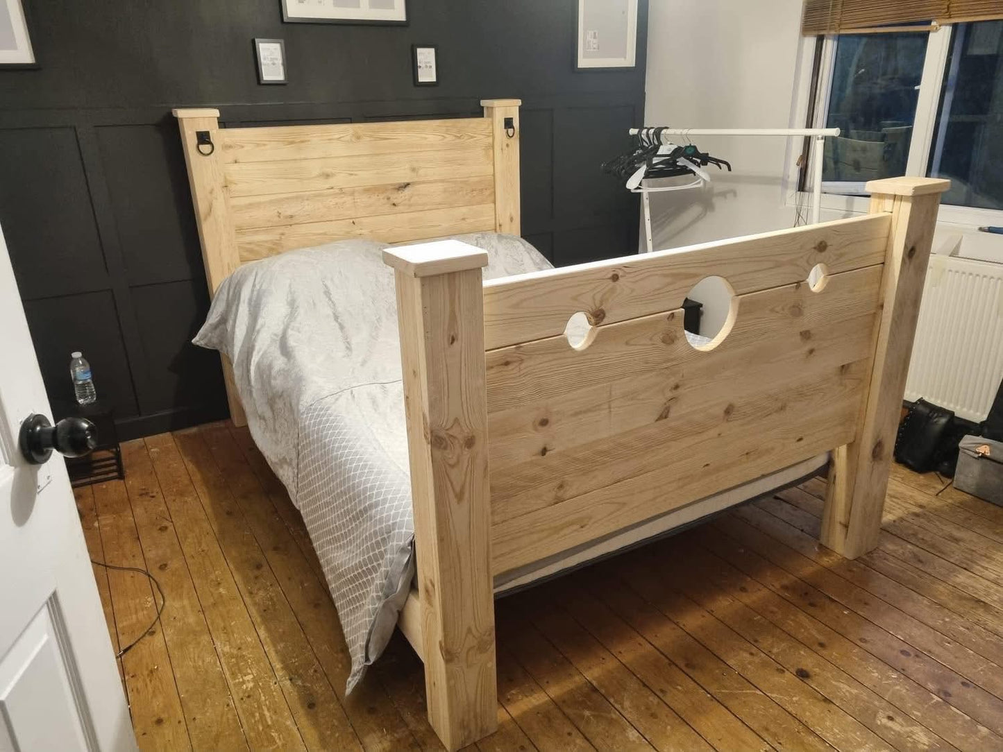 The Jester Bed assembled in a bedroom with stocks footboard