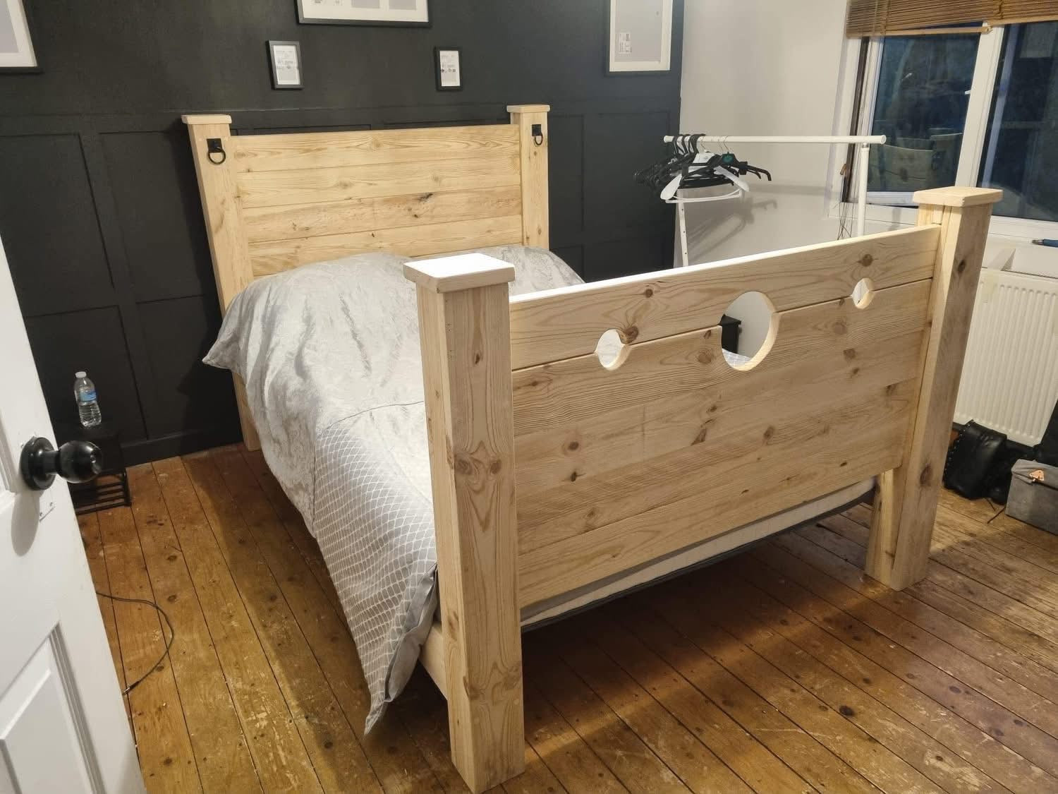 The Jester Bed assembled in a bedroom with stocks footboard